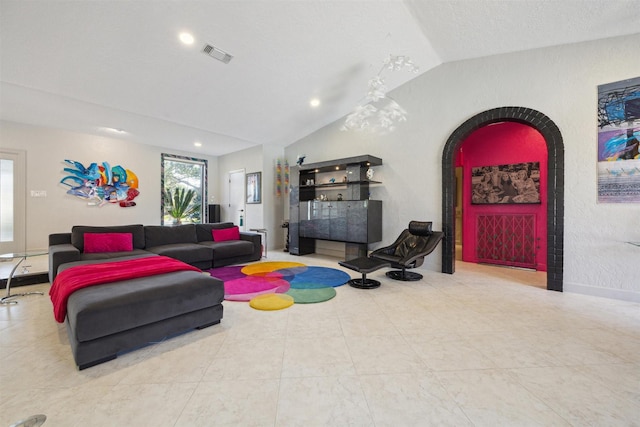 living room with arched walkways, recessed lighting, visible vents, baseboards, and vaulted ceiling