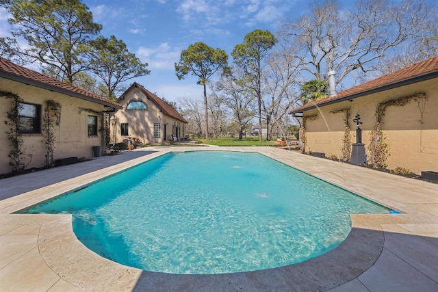 outdoor pool featuring a patio area