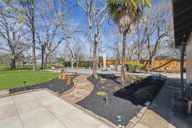 exterior space with a patio area and a fenced backyard