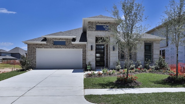 21219 Palm Arbor Dr, Cypress, TX 77433 - view of front of property with a shingled roof, an attached garage, concrete driveway, fence, and brick siding