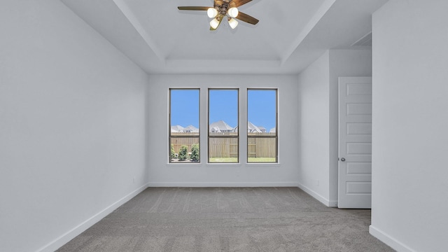 21219 Palm Arbor Dr, Cypress, TX 77433 - unfurnished room with carpet flooring, ceiling fan, a raised ceiling, and baseboards