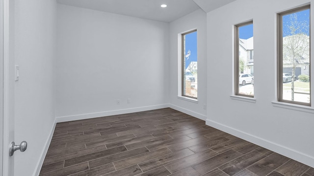 21219 Palm Arbor Dr, Cypress, TX 77433 - spare room featuring plenty of natural light, dark wood-style flooring, baseboards, and recessed lighting