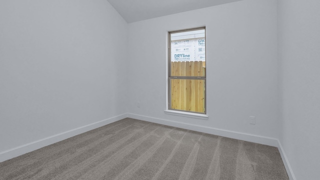 21219 Palm Arbor Dr, Cypress, TX 77433 - empty room with carpet flooring, vaulted ceiling, and baseboards