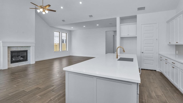 21219 Palm Arbor Dr, Cypress, TX 77433 - kitchen featuring open floor plan, a sink, ceiling fan, dark wood-style flooring, and white cabinetry