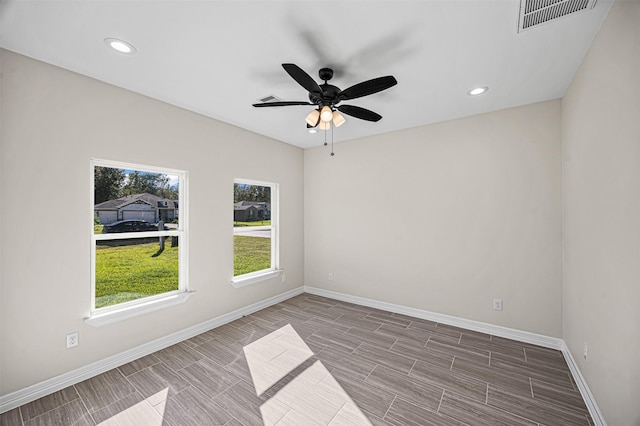 spare room with ceiling fan