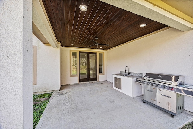 view of patio / terrace with ceiling fan, area for grilling, sink, and french doors