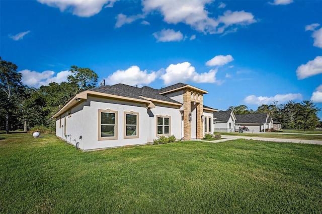 view of side of home with a lawn