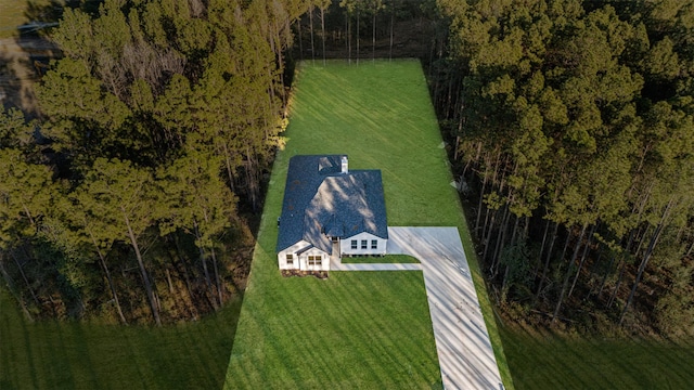 drone / aerial view featuring a rural view and a view of trees