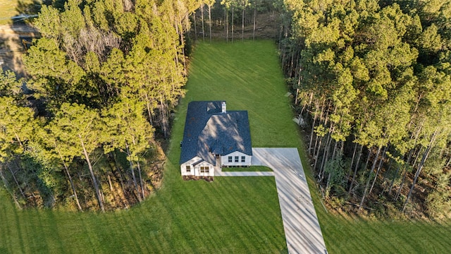 birds eye view of property with a rural view and a wooded view