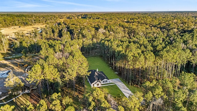 drone / aerial view featuring a forest view