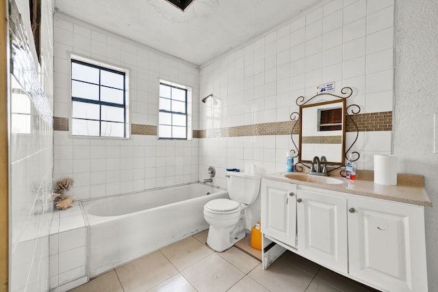 bathroom featuring tile walls, tile patterned flooring, vanity, and toilet