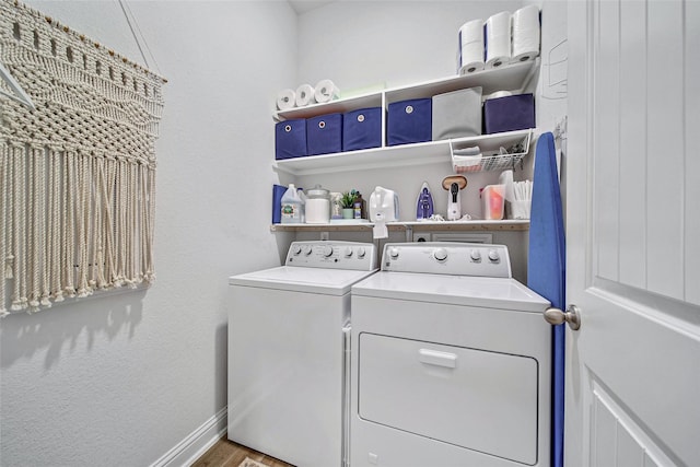 laundry area featuring hardwood / wood-style flooring and independent washer and dryer