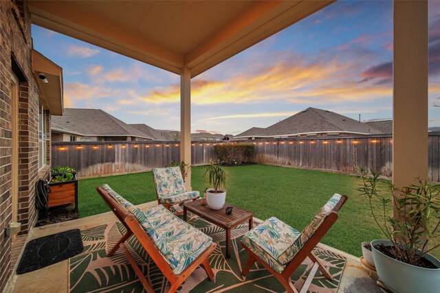 patio terrace at dusk with a yard