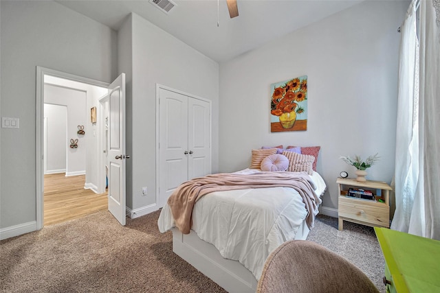 bedroom featuring carpet floors, a closet, and ceiling fan