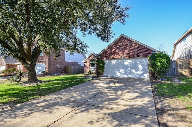 view of front of house featuring a garage, concrete driveway, brick siding, and fence