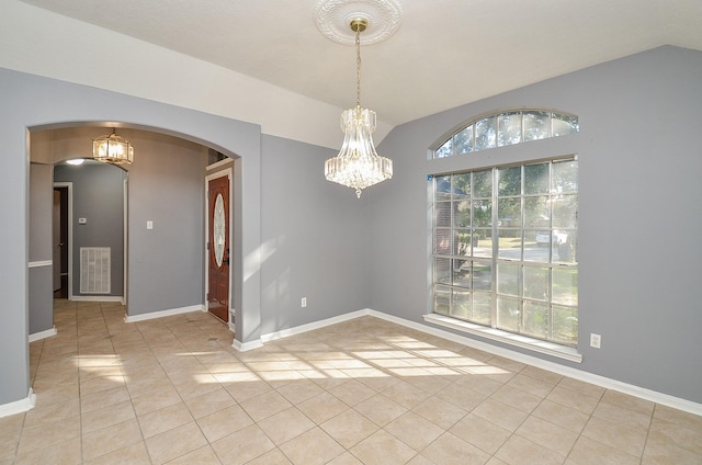 unfurnished room with arched walkways, a notable chandelier, light tile patterned floors, vaulted ceiling, and baseboards