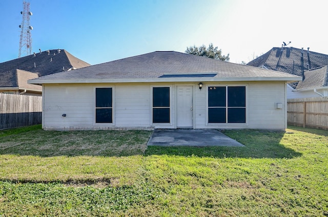 back of house with a patio area, a fenced backyard, and a yard