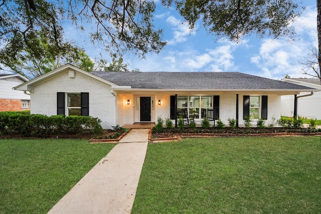 single story home with a porch and a front lawn