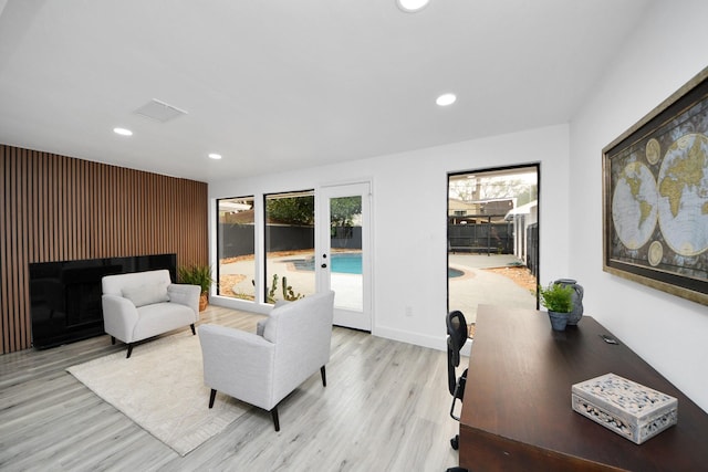 living room with light hardwood / wood-style floors