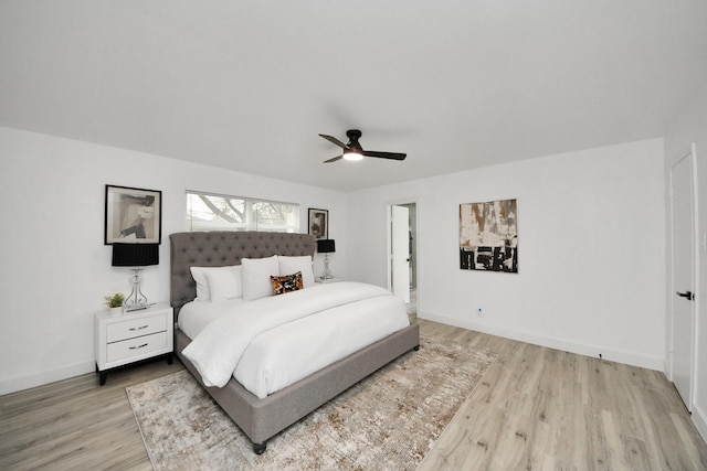 bedroom with ceiling fan and light hardwood / wood-style flooring