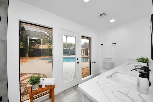 bathroom with toilet and vanity