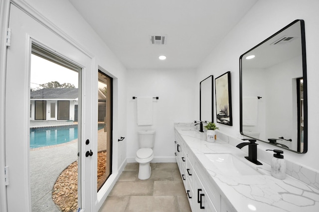 bathroom with toilet and vanity