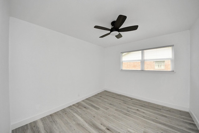 spare room with ceiling fan and light hardwood / wood-style flooring