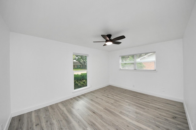 unfurnished room with light hardwood / wood-style flooring and ceiling fan