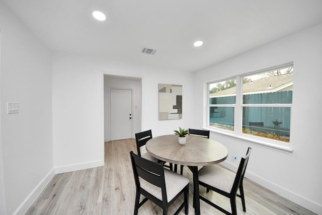 dining space featuring light wood-type flooring