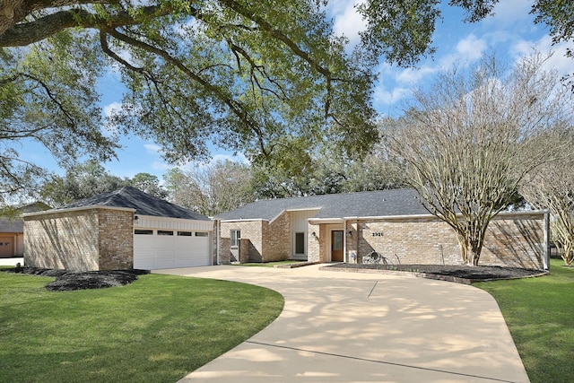 mid-century modern home featuring a shingled roof, a garage, brick siding, and a front lawn