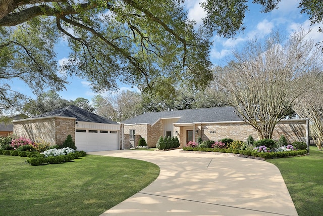 mid-century home with a shingled roof, a front yard, concrete driveway, and brick siding