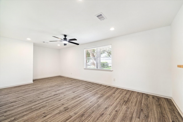 spare room featuring ceiling fan and hardwood / wood-style floors