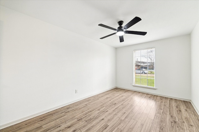 unfurnished room featuring light hardwood / wood-style flooring and ceiling fan