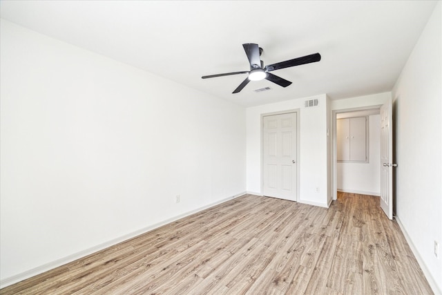 unfurnished bedroom with light wood-type flooring and ceiling fan