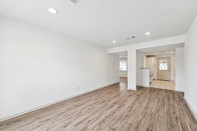 unfurnished living room with light hardwood / wood-style floors