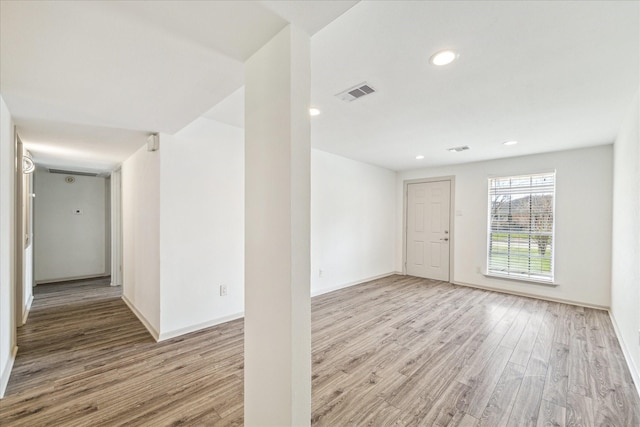 spare room with light hardwood / wood-style flooring