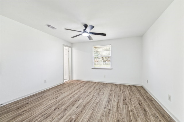 spare room with light hardwood / wood-style floors and ceiling fan