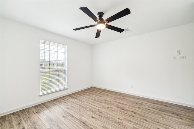 unfurnished room featuring ceiling fan and light hardwood / wood-style floors