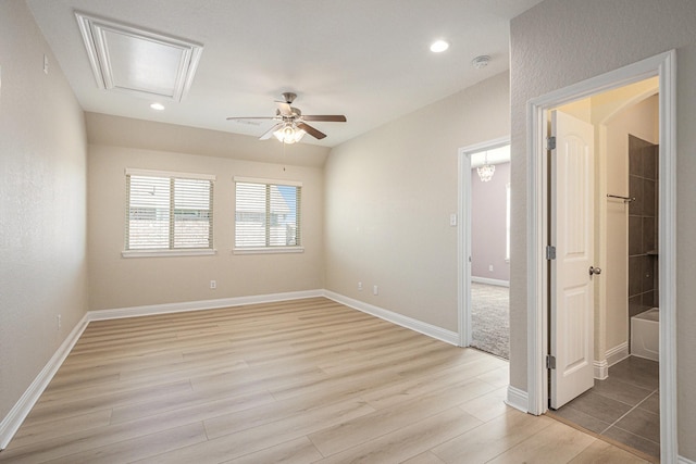 empty room with ceiling fan, baseboards, light wood-style flooring, and recessed lighting