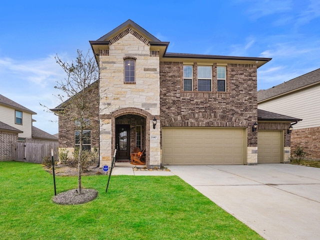 view of front of property with a garage and a front yard