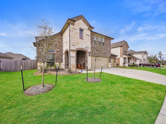 view of front of home with a garage and a front lawn