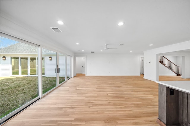 interior space with recessed lighting, visible vents, stairway, light wood-style flooring, and baseboards