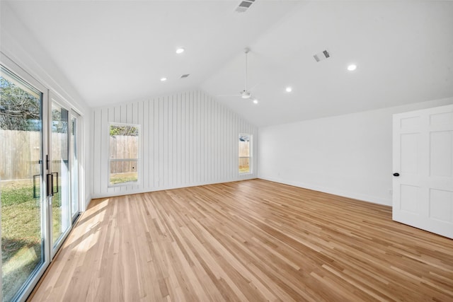 interior space with lofted ceiling, light wood finished floors, baseboards, and recessed lighting