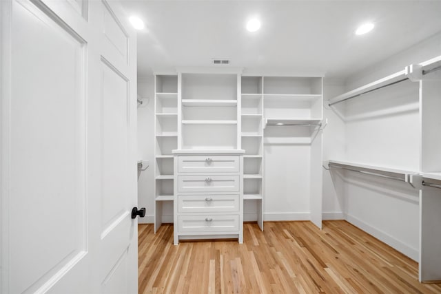 spacious closet featuring light wood-style floors and visible vents