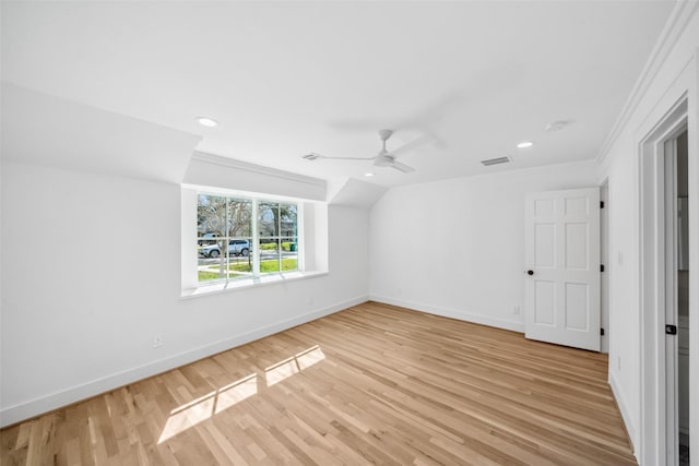 unfurnished room featuring light wood-type flooring, baseboards, and ornamental molding