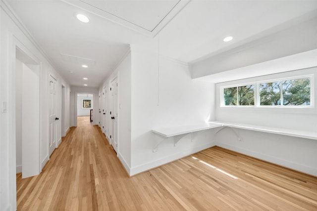 hall with recessed lighting, light wood-type flooring, attic access, and baseboards