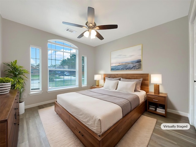 bedroom featuring ceiling fan and wood-type flooring