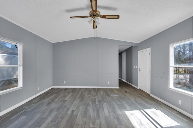 unfurnished room featuring ceiling fan, a textured ceiling, vaulted ceiling, and dark wood-style flooring