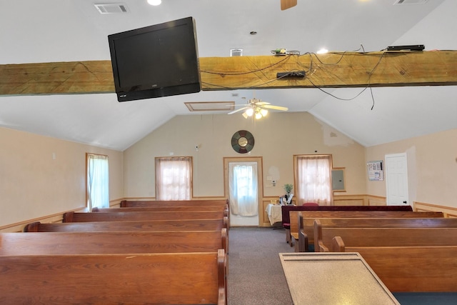 interior space featuring carpet floors, a wainscoted wall, visible vents, and ceiling fan