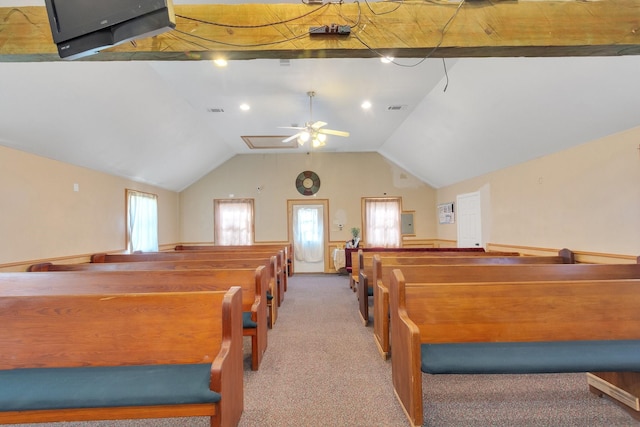 carpeted bedroom featuring vaulted ceiling and visible vents